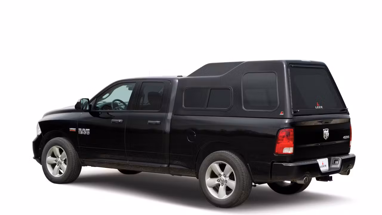 Image of a black Ram 1500 with extra tall camper shell