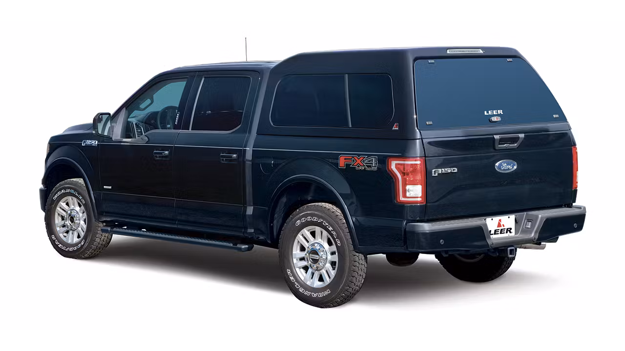 Image of a blue ford f150 4x4 with side steps