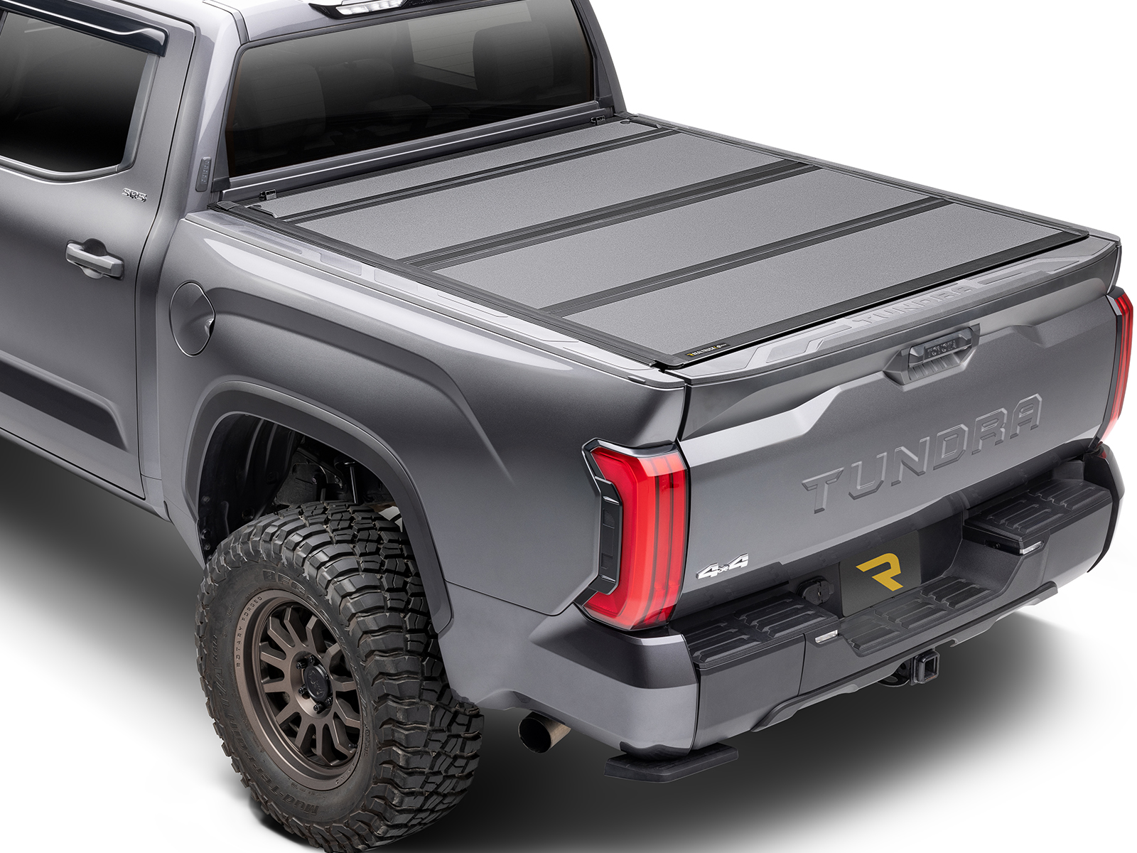 Image of a grey Toyota Tundra with a truck bed cover in Albuquerque