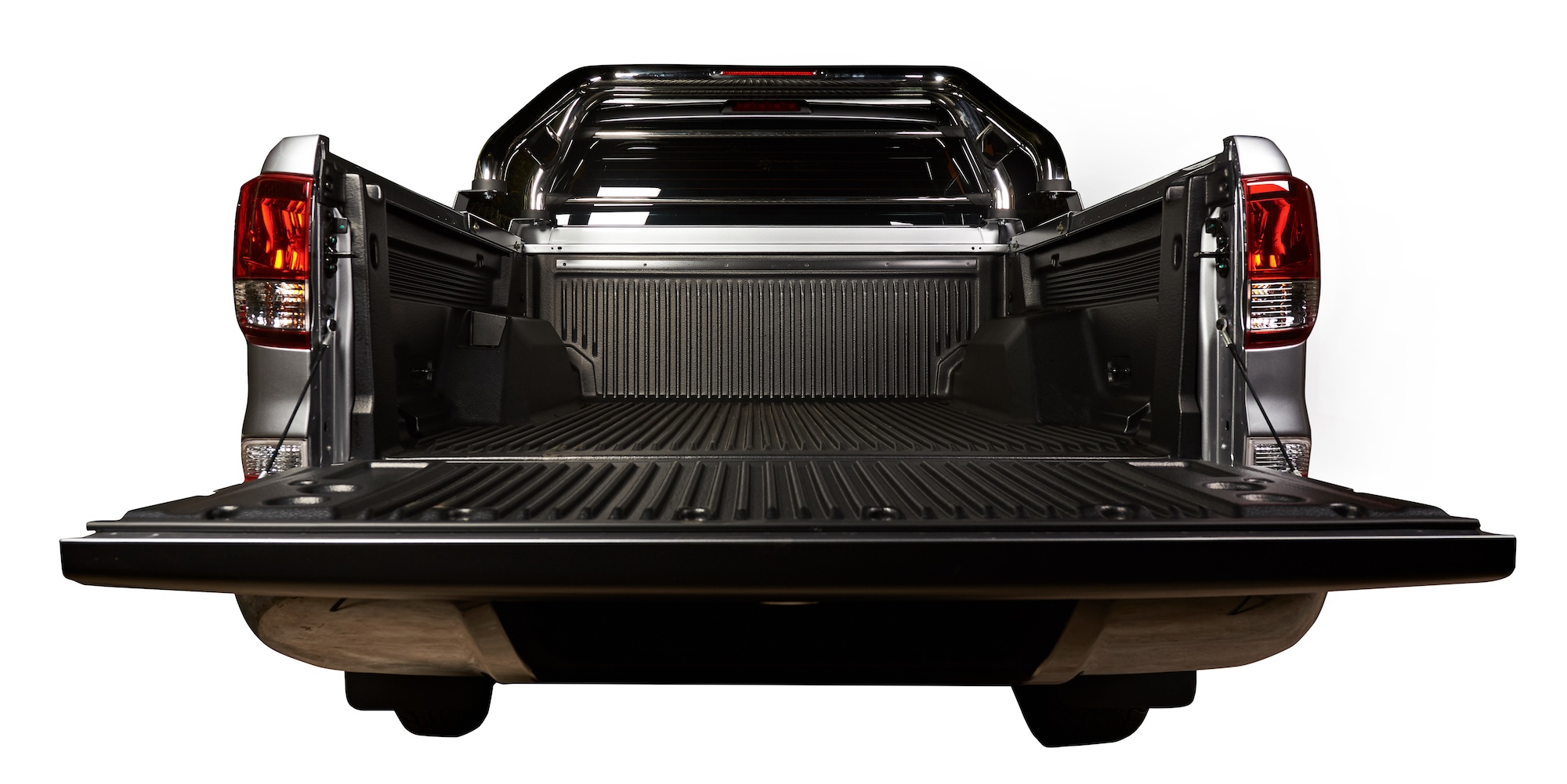 Image of a Ford F150 truck with topper and camping accessories