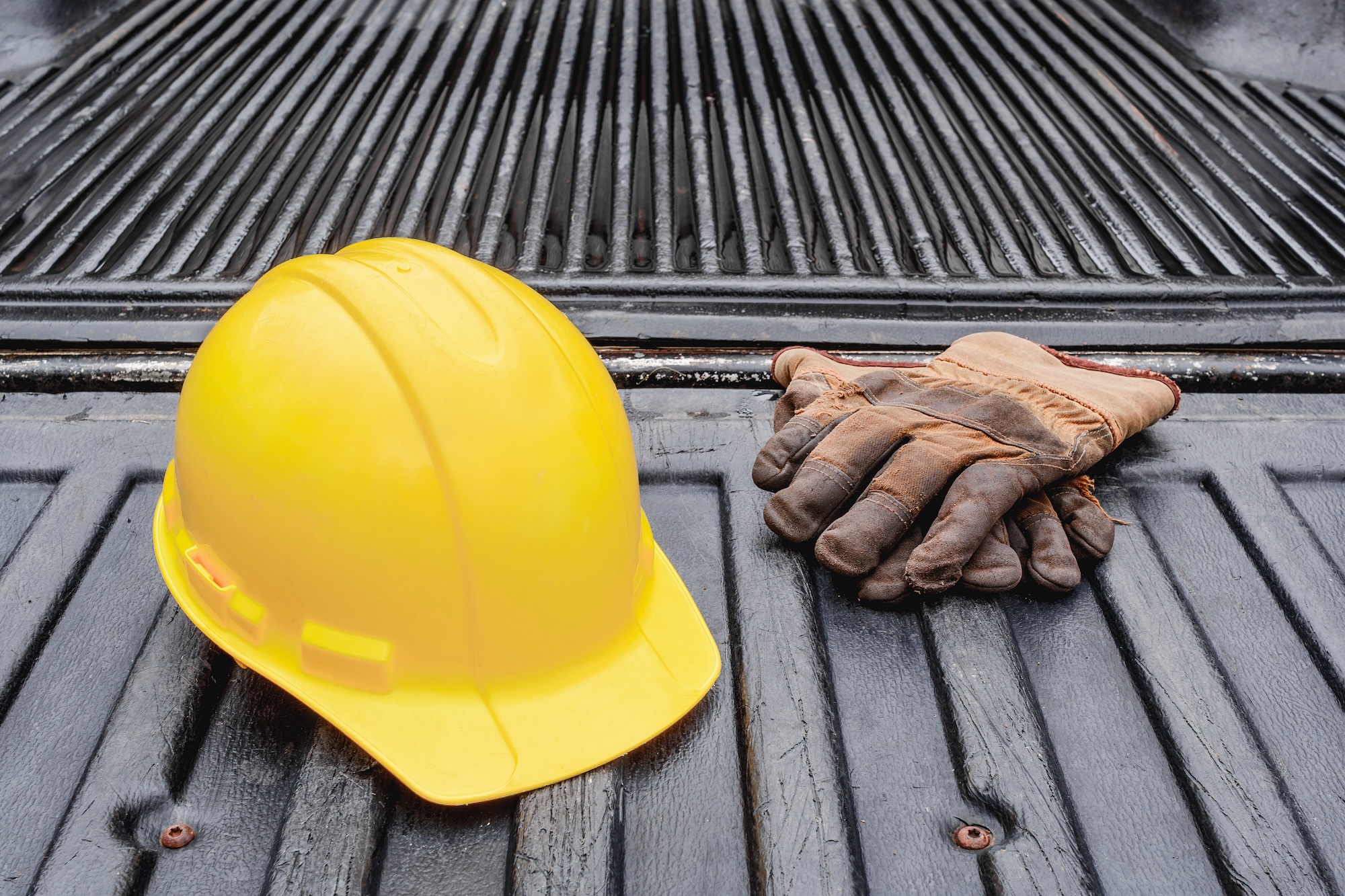 Image of a Ford F150 truck with topper and camping accessories